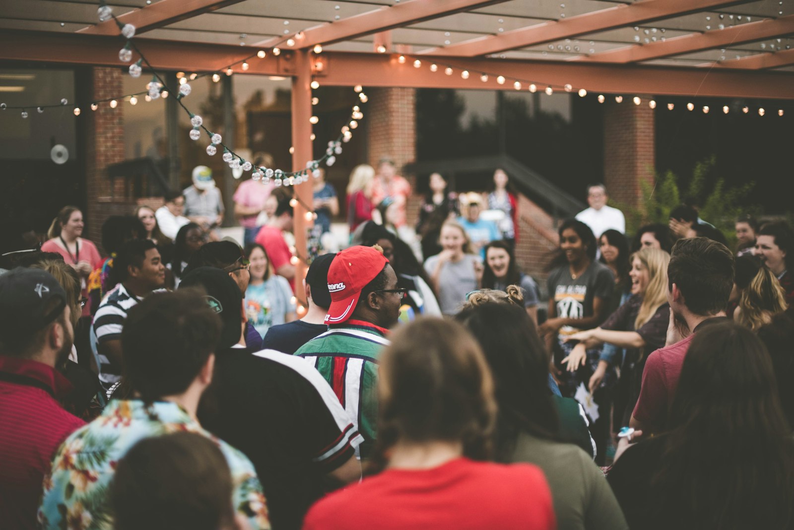 Crowd laughing at a busy indoor pop-up