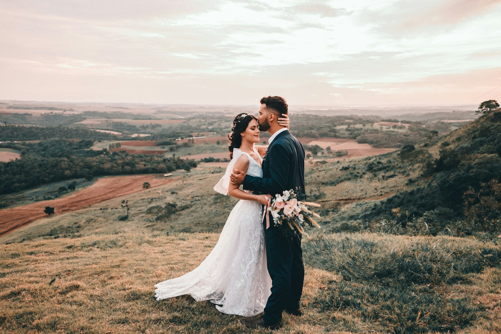 Couple kissing in a golden field
