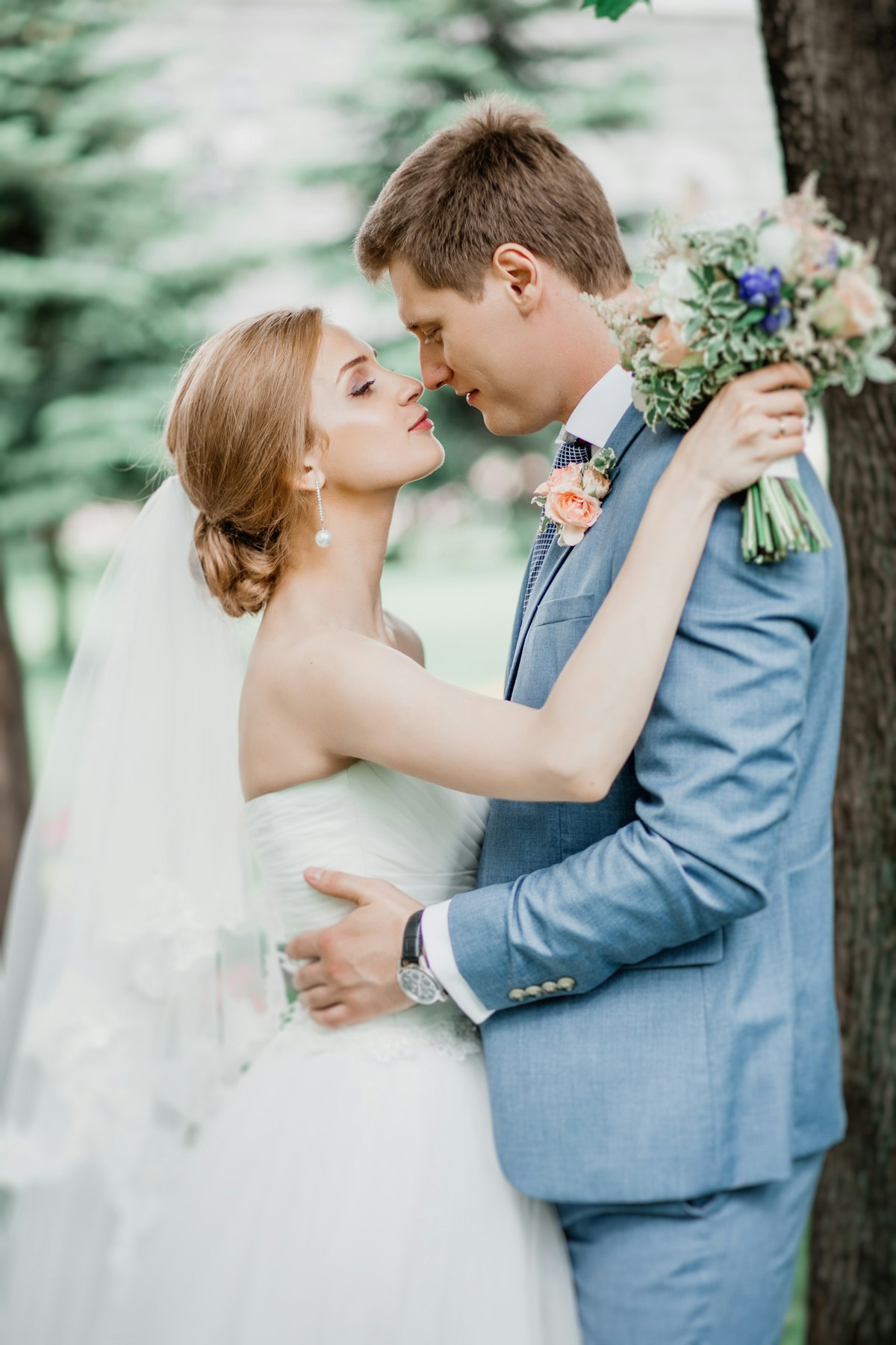 Couple sharing a kiss under a veil